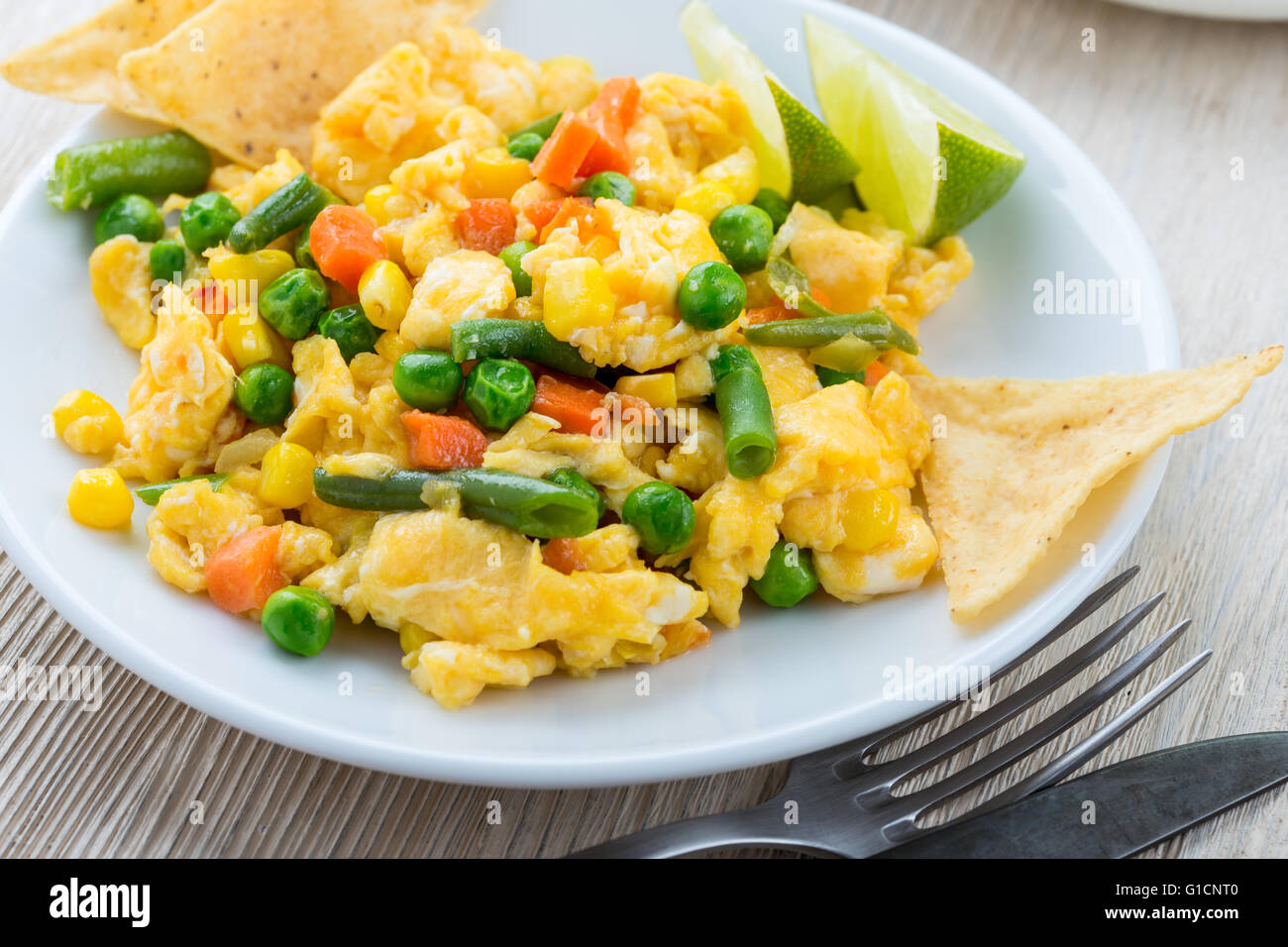 Homemade mexican salad scrambled egg served with baked corn tortilla