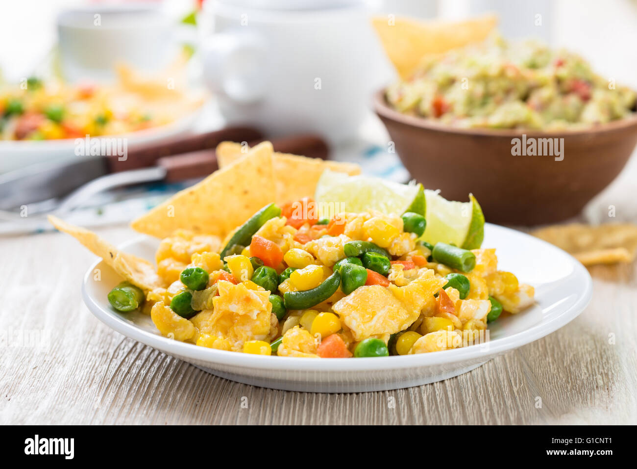 Homemade mexican salad scrambled egg served with corn tortilla chips