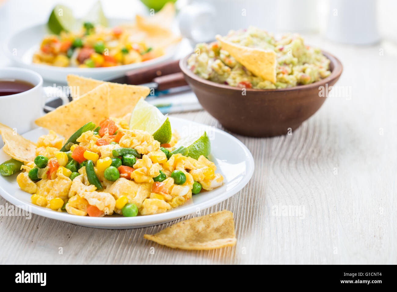 Homemade mexican salad scrambled egg served with corn tortilla chips
