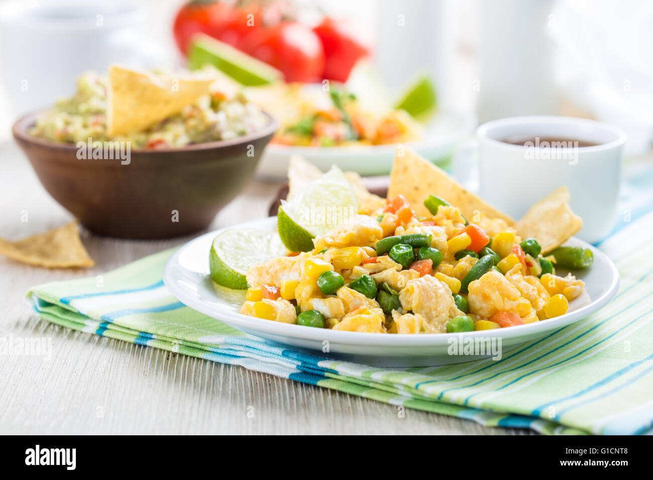 Homemade mexican salad scrambled egg served with corn tortilla chips