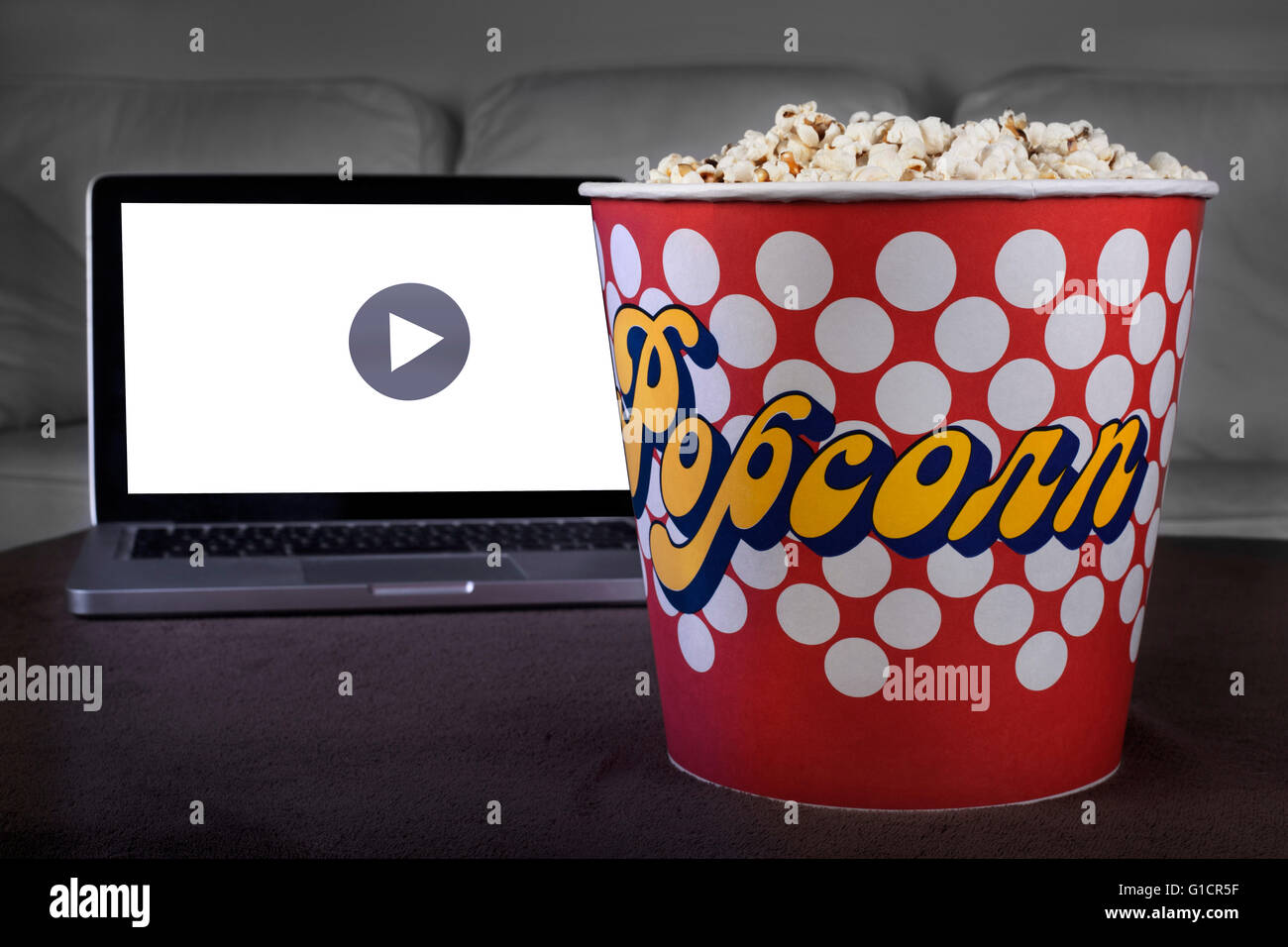 Movie online with popcorn at home Stock Photo