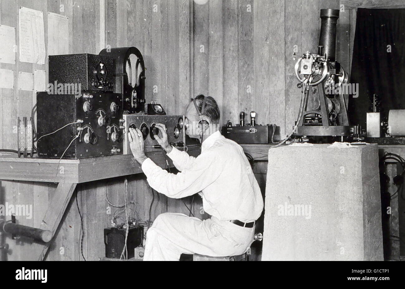 Joseph Lushene operating long-wave radio receiver. Attempting to receive time ticks. Stock Photo