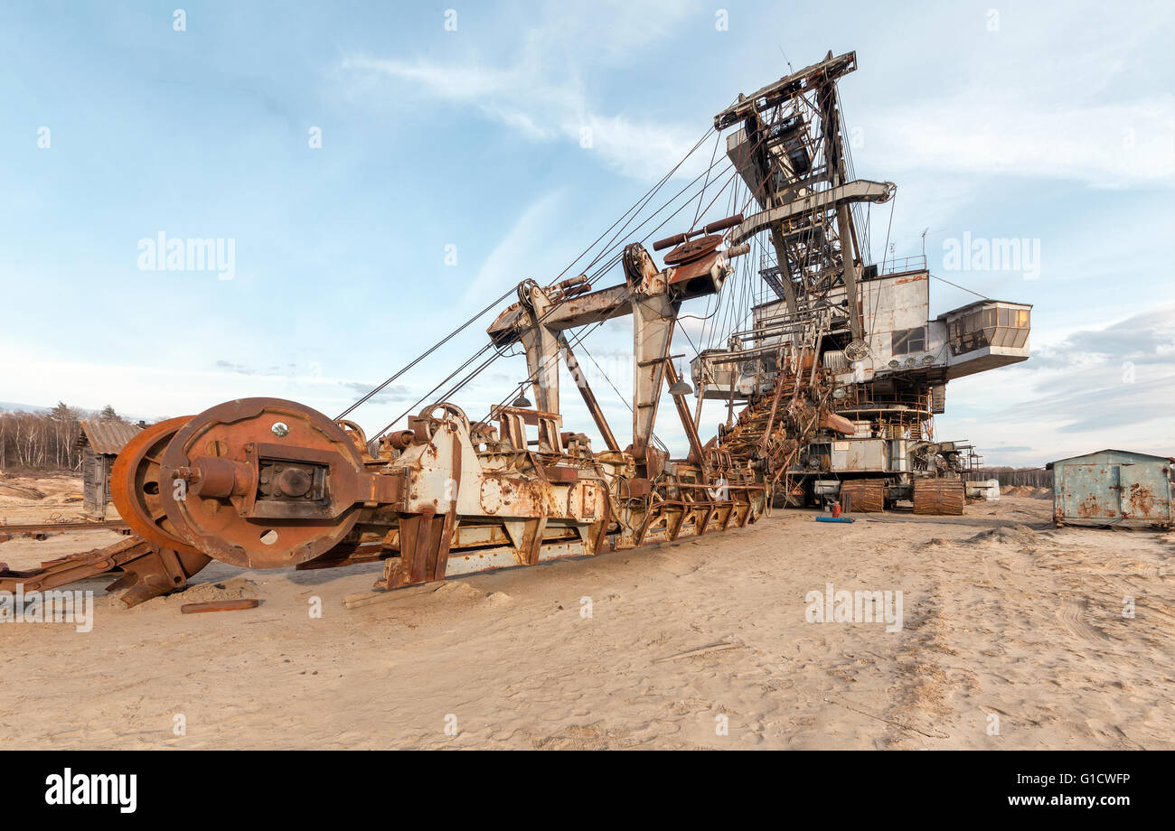 Many buckets of giant quarry excavator Equipment for the extraction of sand from the quarry. Stock Photo