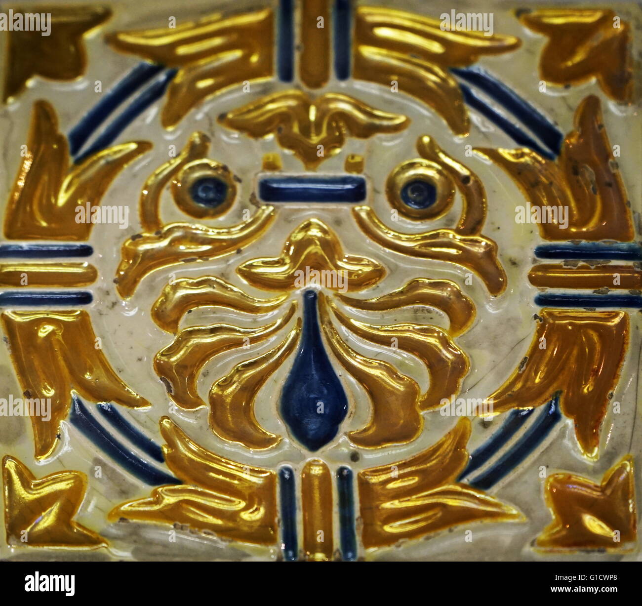 Gold lustre tile with two lions, by William De Morgan (1839-1917) an English potter and tile designer. Dated 19th Century Stock Photo