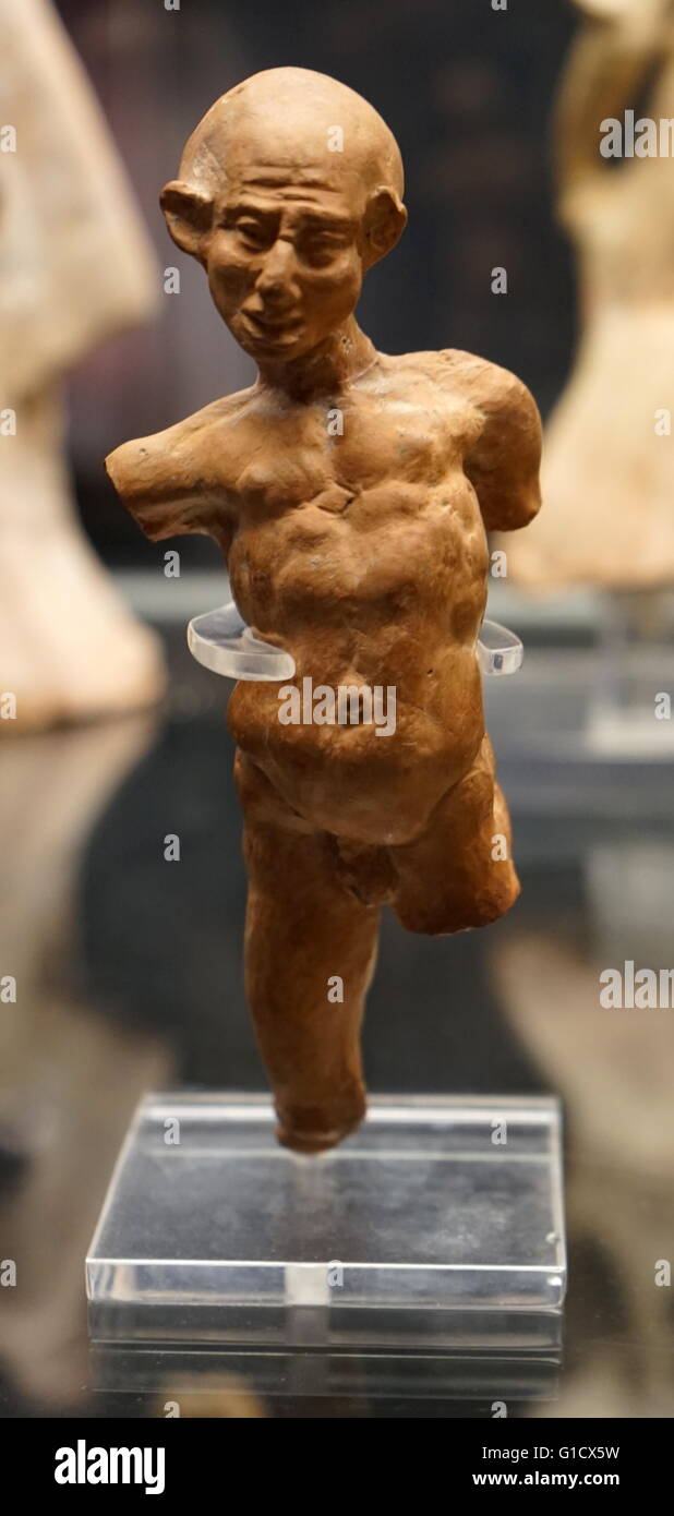 Terracotta figure of a grotesquely deformed and twisted man. Dated 1st Century BC Stock Photo