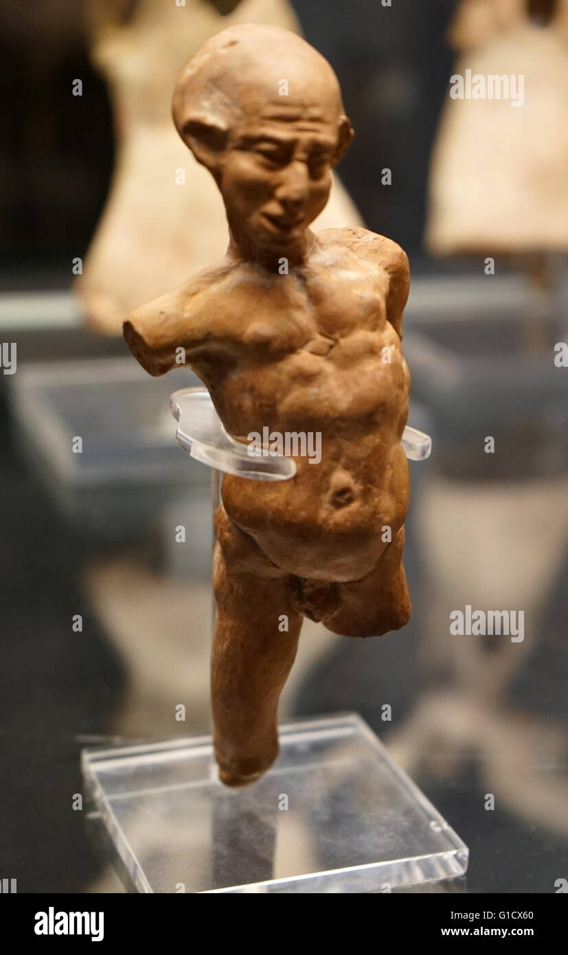 Terracotta figure of a grotesquely deformed and twisted man. Dated 1st Century BC Stock Photo