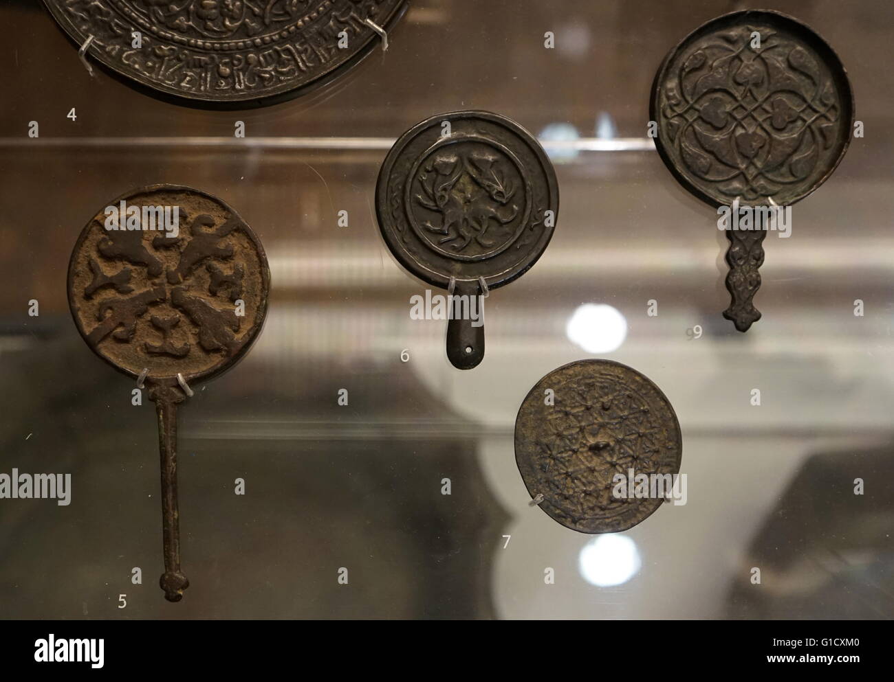 Medieval mirrors from the Eastern Islamic world, made from cast copper alloy. Dated 11th Century