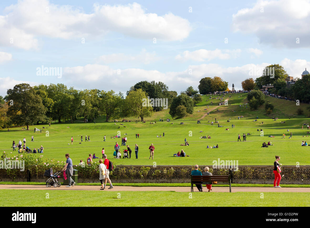 People enjoying a sunny day in Greenwich Park London Stock Photo