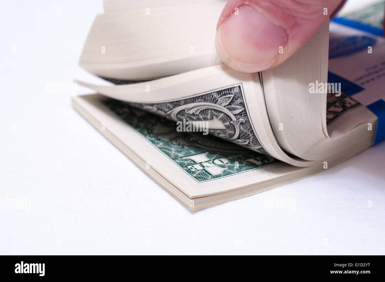 US Dollars - money being thumbed through Stock Photo