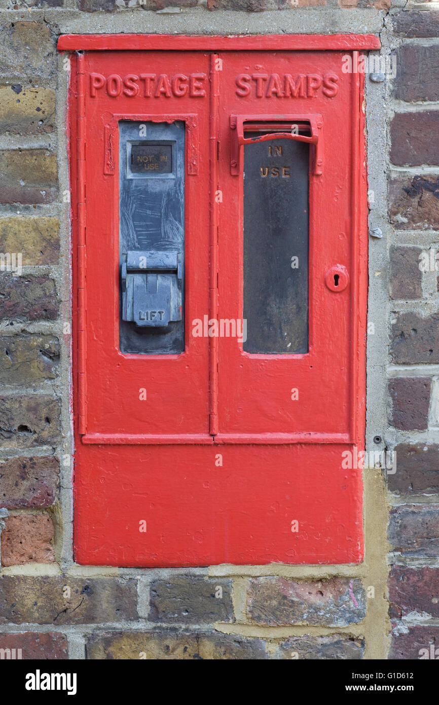 Vintage postage stamp dispenser Stock Photo - Alamy