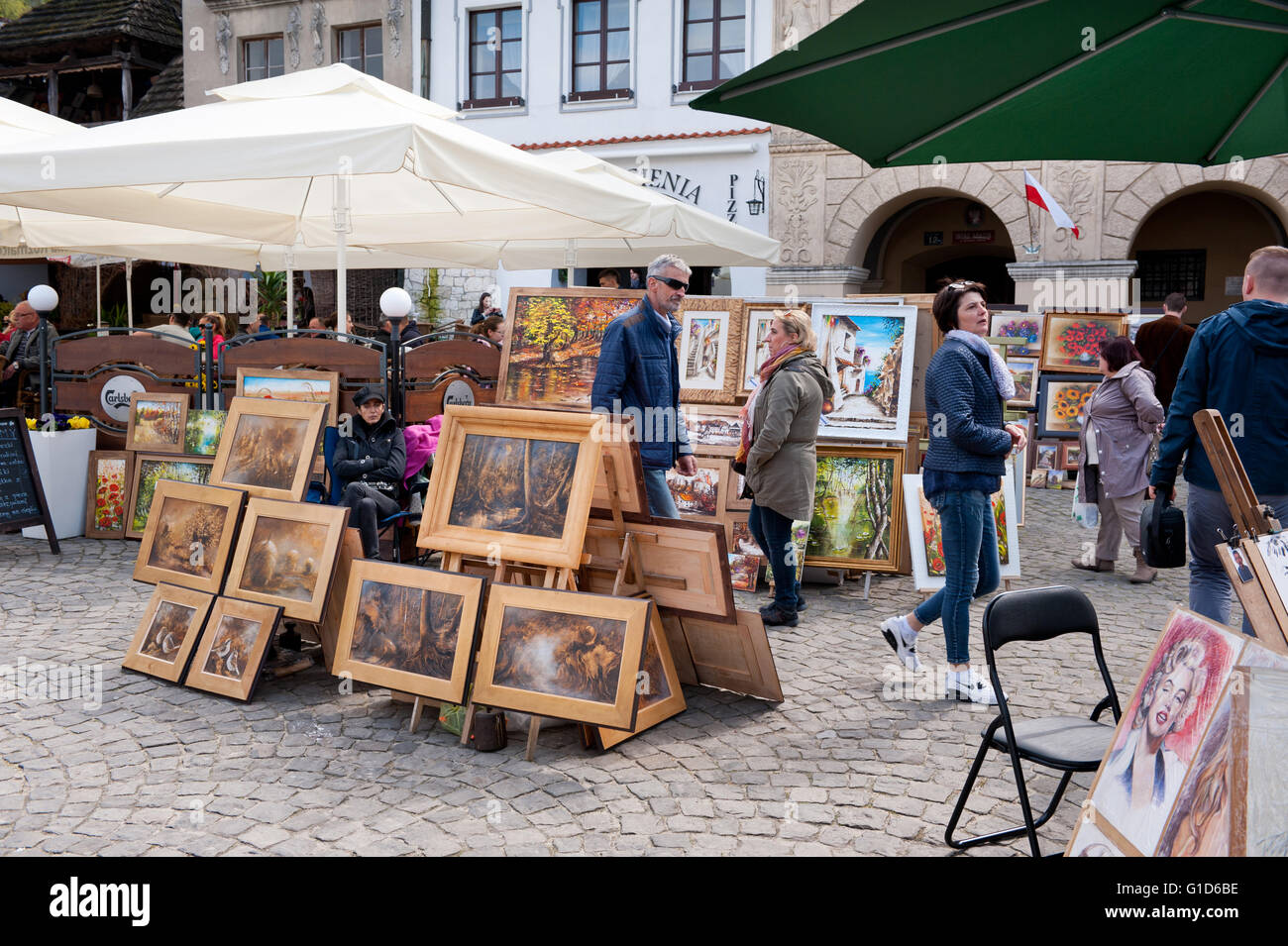 Paintings display at the bazaar in Kazimierz Dolny, Poland, Europe, bohemian tourist travel destination, sightseeing popular. Stock Photo