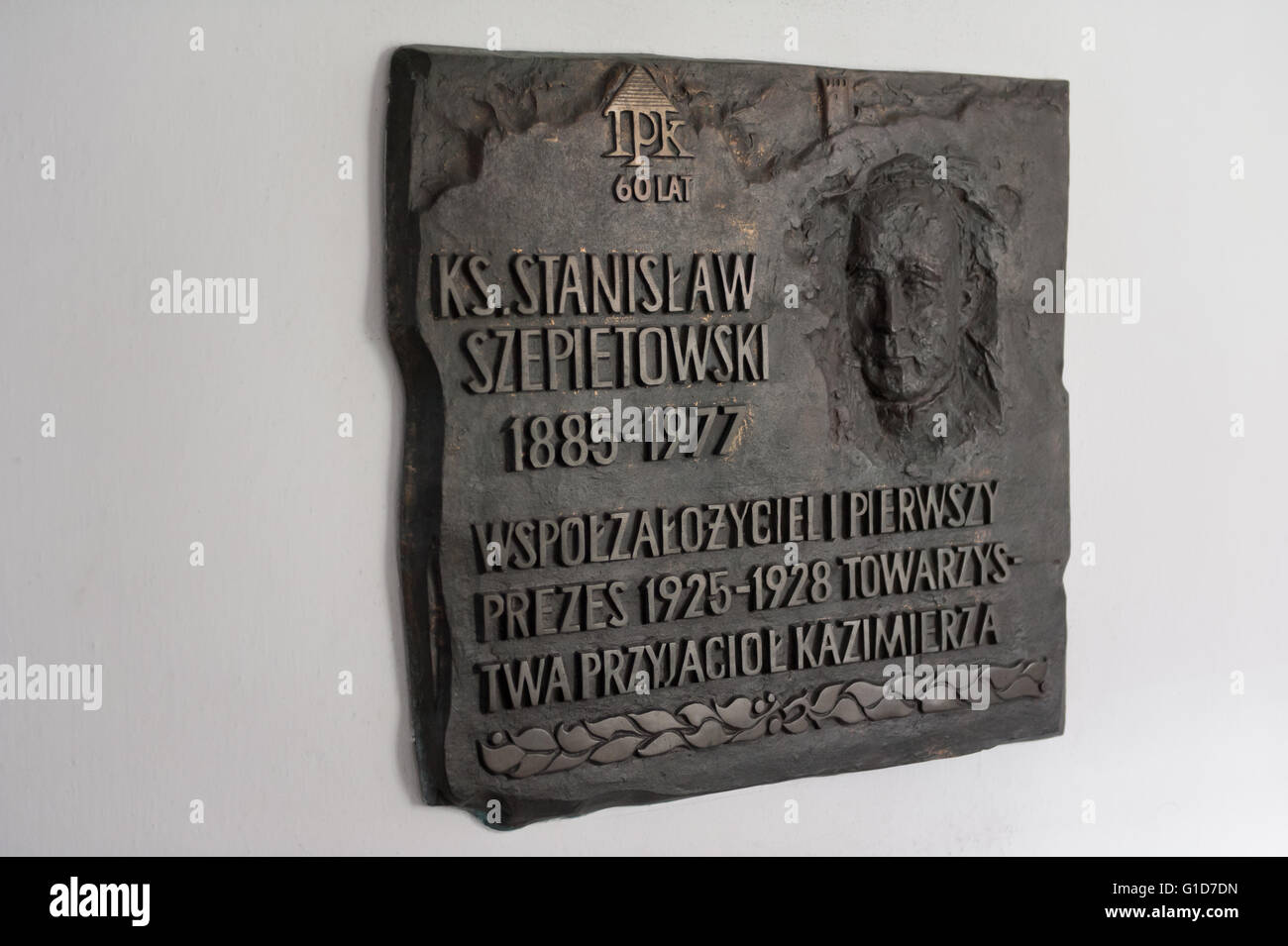 Stanislaw Szepietowski commemorative plaque in the monastic cloister of quadrangle, patio surrounding a pleasure garden, Poland. Stock Photo