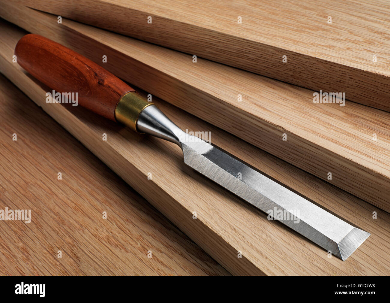Chisel with white American oak boards Stock Photo