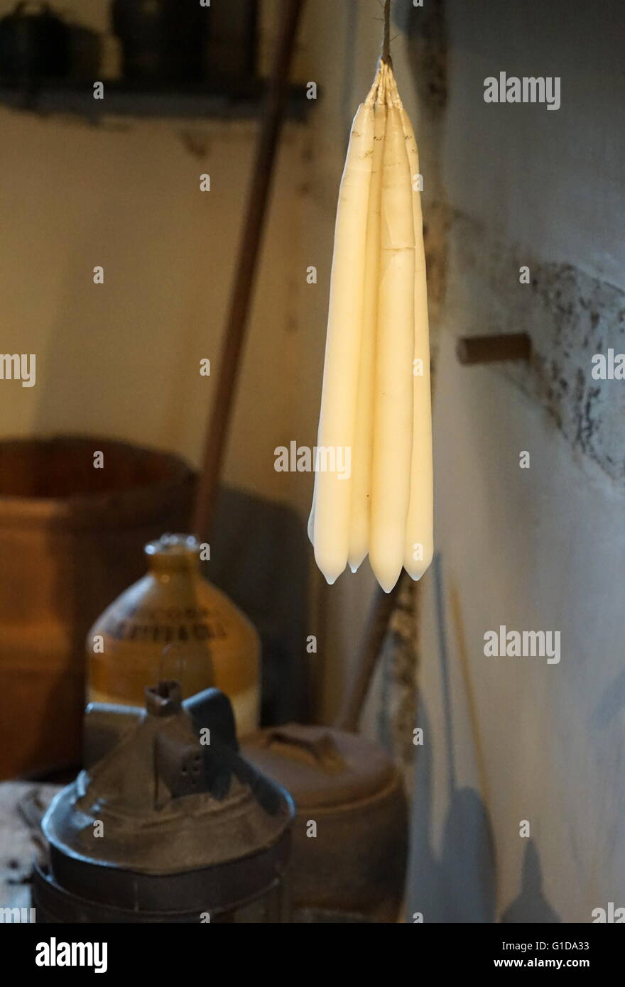Elizabethan; animal fat candles hanging in a Tudor kitchen; England