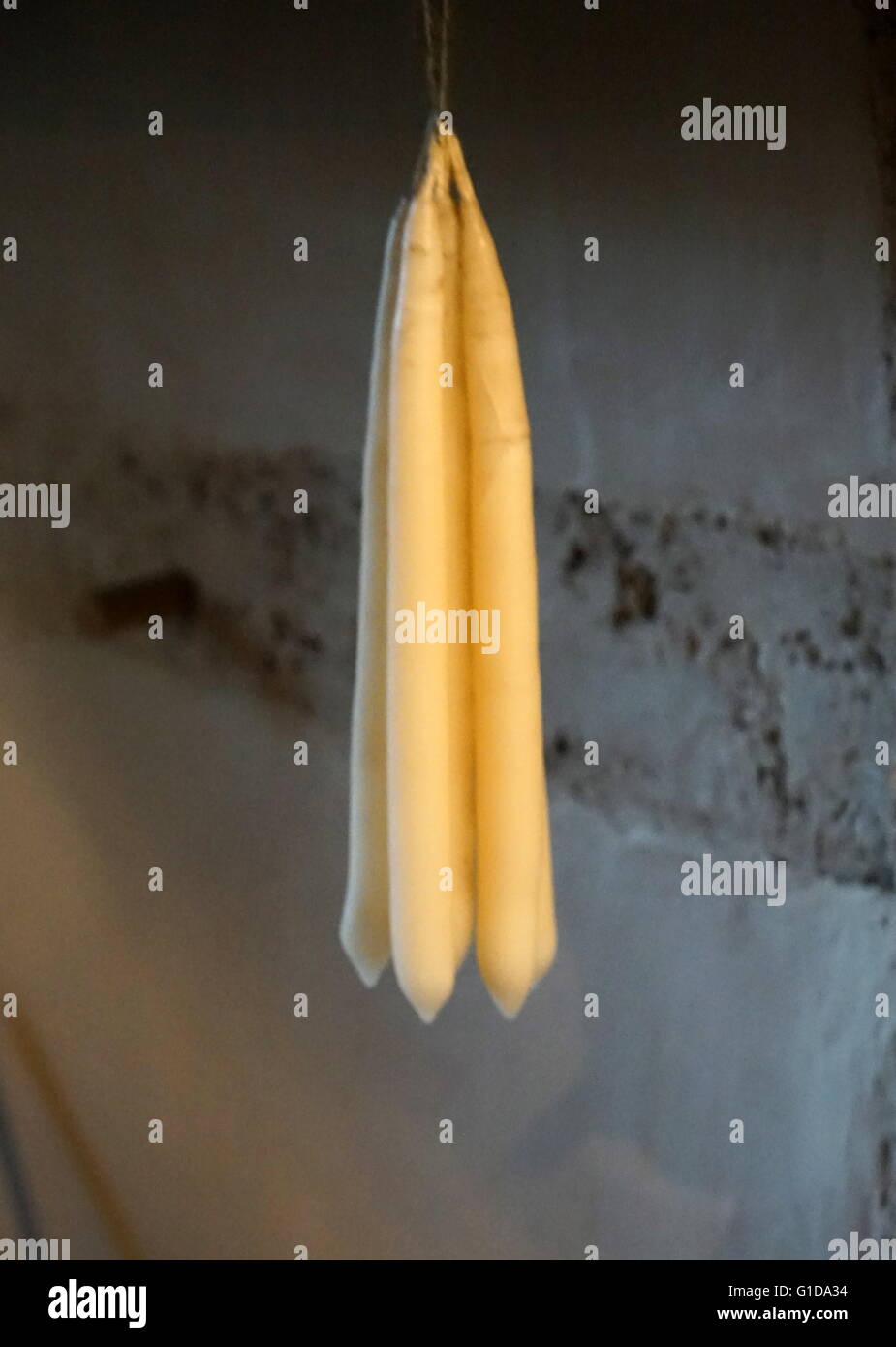 Elizabethan; animal fat candles hanging in a Tudor kitchen; England