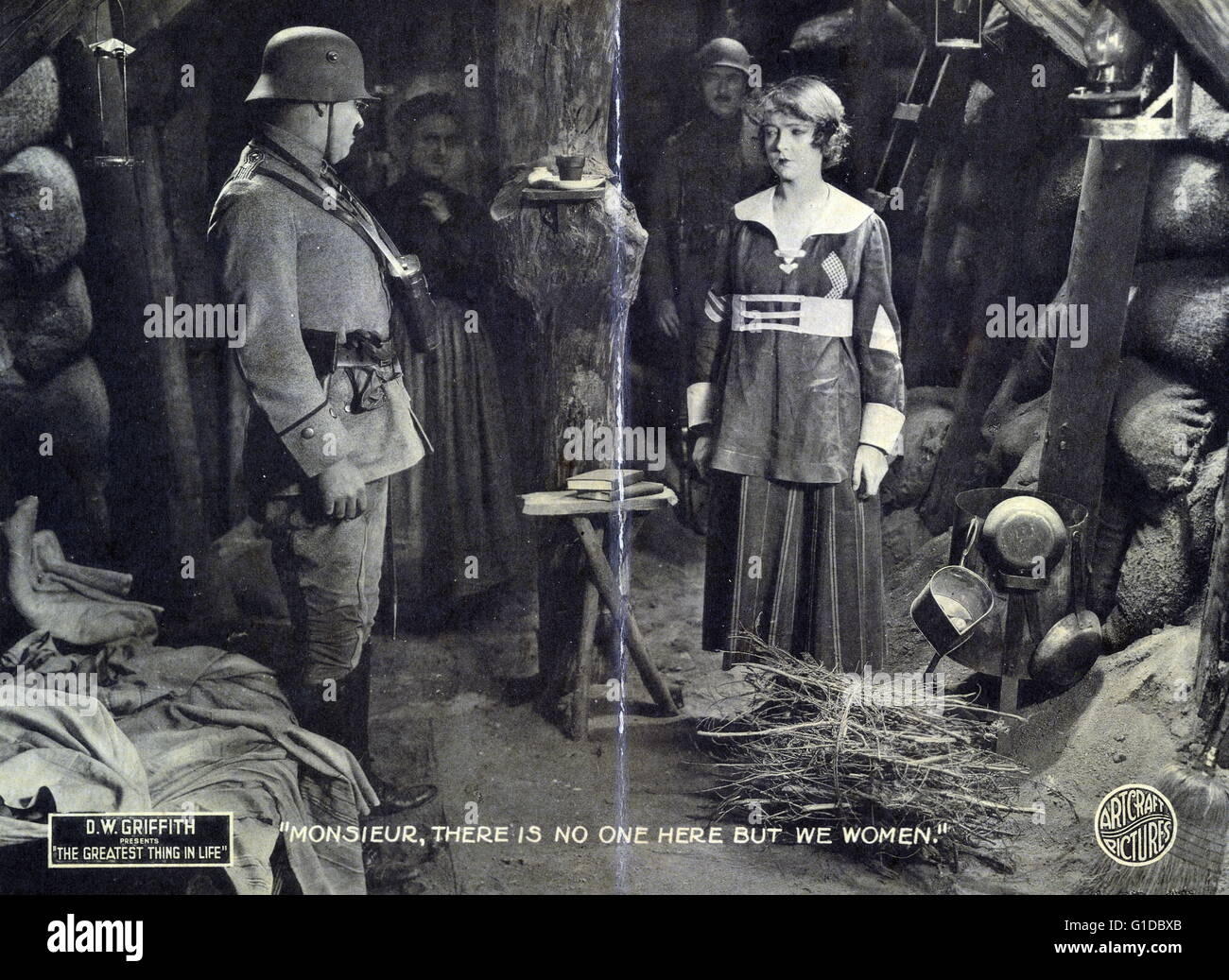 lobby card for 'The greatest thing in life' 1918. shows Lillian Gish in underground bunker facing German officer; Kate Bruce standing in background with soldier. Stock Photo