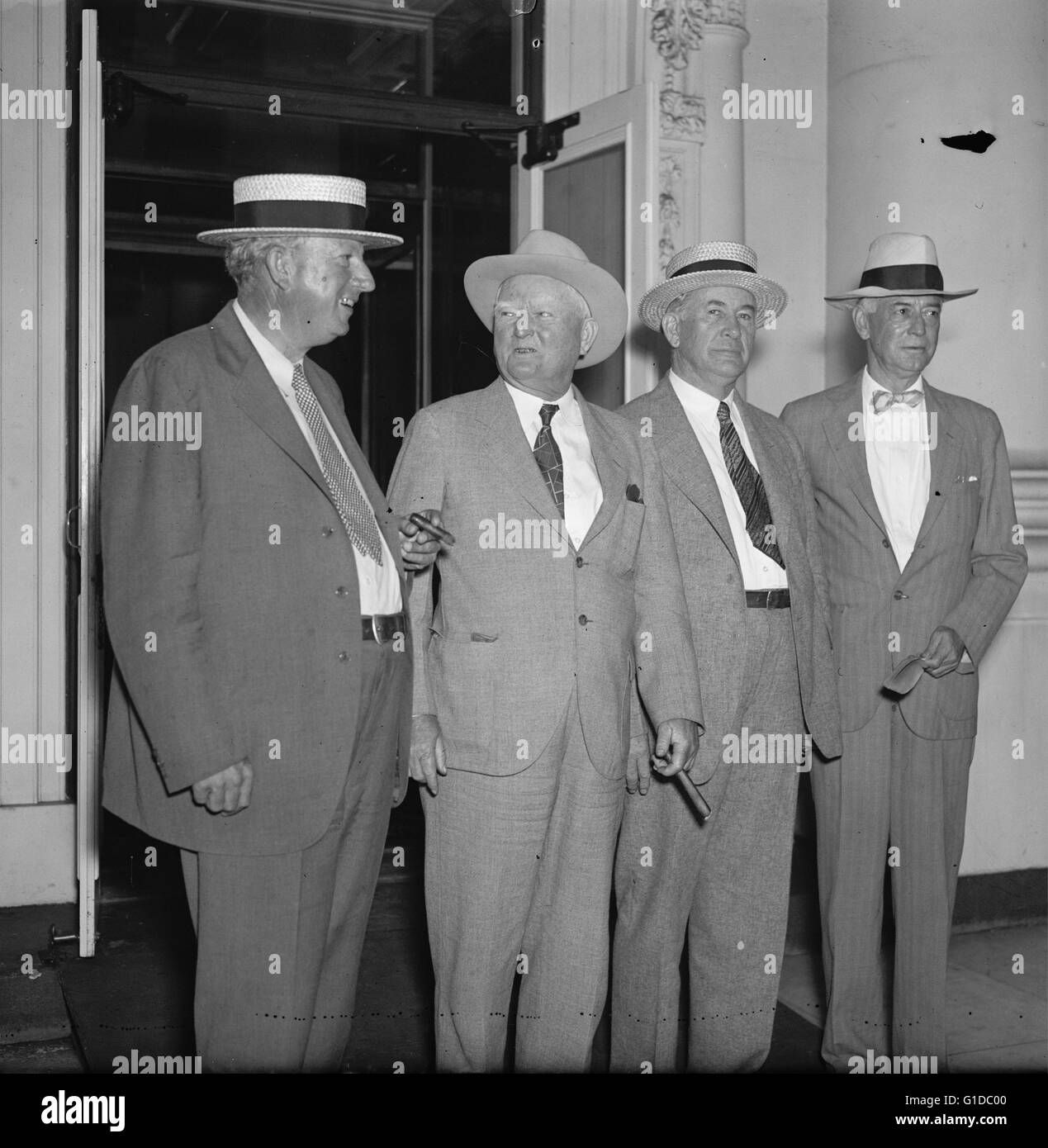 Four leading politicians from the Democratic Party were invited today to a conference given by President Roosevelt. Although denials were made it was believed that the conference was to be made in connection with the appointment of the new Majority Leader of the Senate, a post left vacant by the death of Senator Joe Robinson of Arkansas. Among four, there were the only two apposing candidates, namely Sen. Pat Harrison of Mississippi and Sen. Alben W. Barkley, and Key Pittman Stock Photo