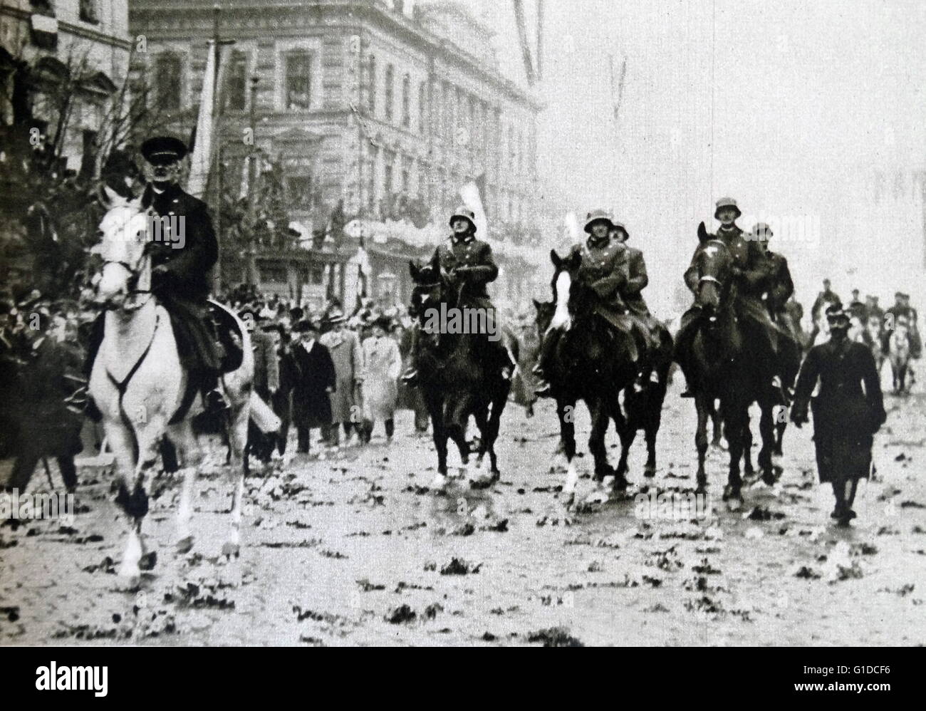 Photographic print of Miklós Horthy de Nagybánya (1868-1957) a Hungarian admiral and statesman, who served as Regent of the Kingdom of Hungary between World Wars I and II, riding horseback through streets. Dated 20th Century Stock Photo