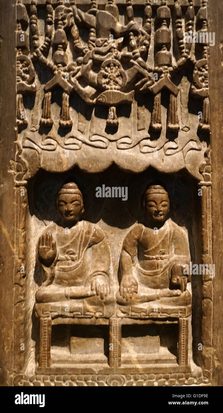 Votive stele of a Chinese Buddhist in limestone from the Northern Qi Dynasty. Dated 6th Century. Stock Photo