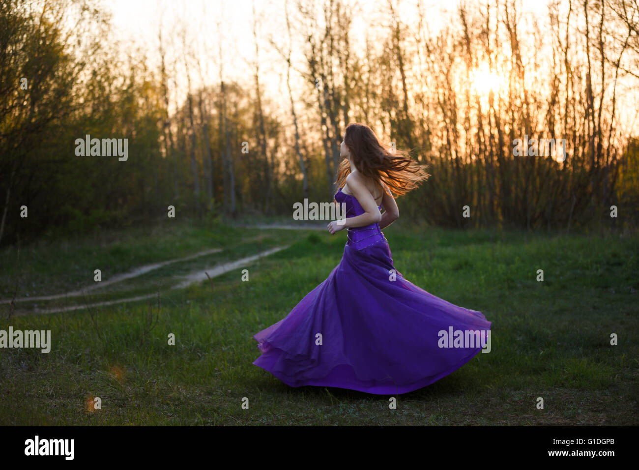 Purple dress gown hi-res stock photography and images - Alamy