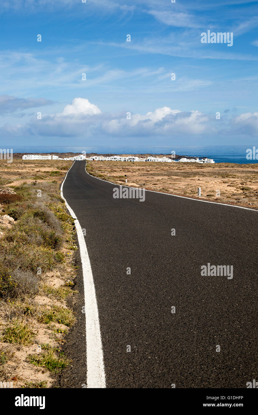 Road approaching Caleta de Caballo village, Lanzarote, Canary islands, Spain Stock Photo