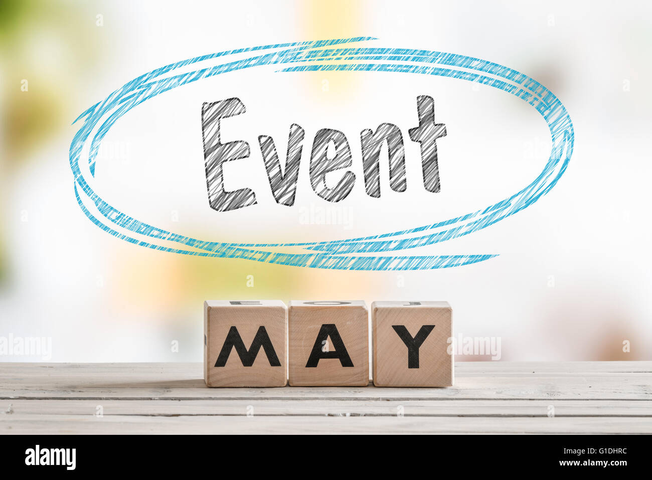 May event sign on a wooden table with text Stock Photo