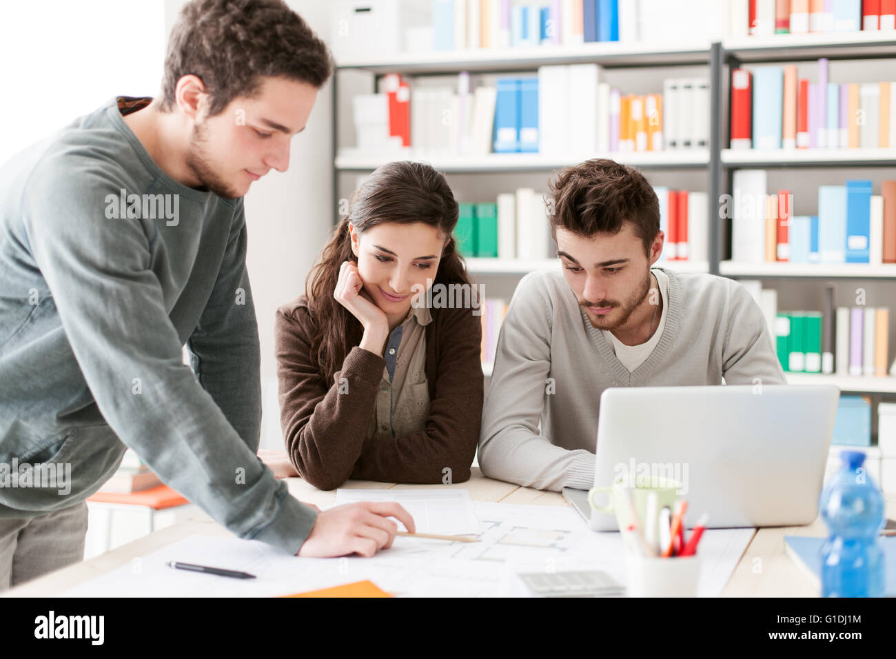 College students working together on a design project, education and learning concept Stock Photo