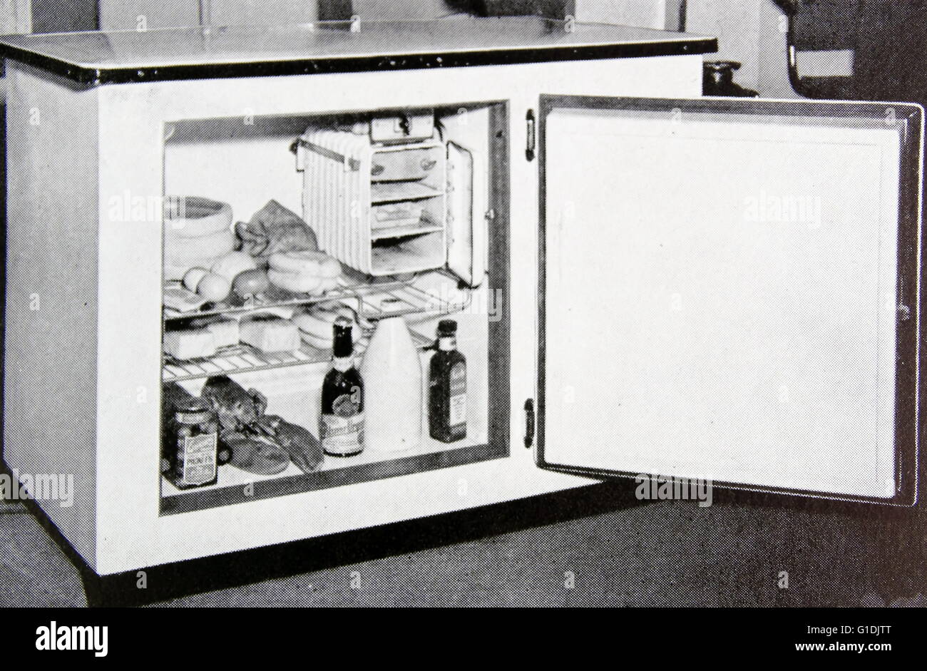 Table top electric fridge with a freezer section, c1950 Britain Stock