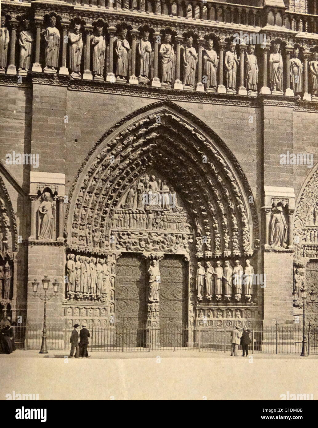 Photographic print of the central door and façade of the Cathedral of Notre-Dame, a historic Catholic cathedral on the eastern half of the Île de la Cité in the fourth arrondissement of Paris, France. Dated 19th Century Stock Photo