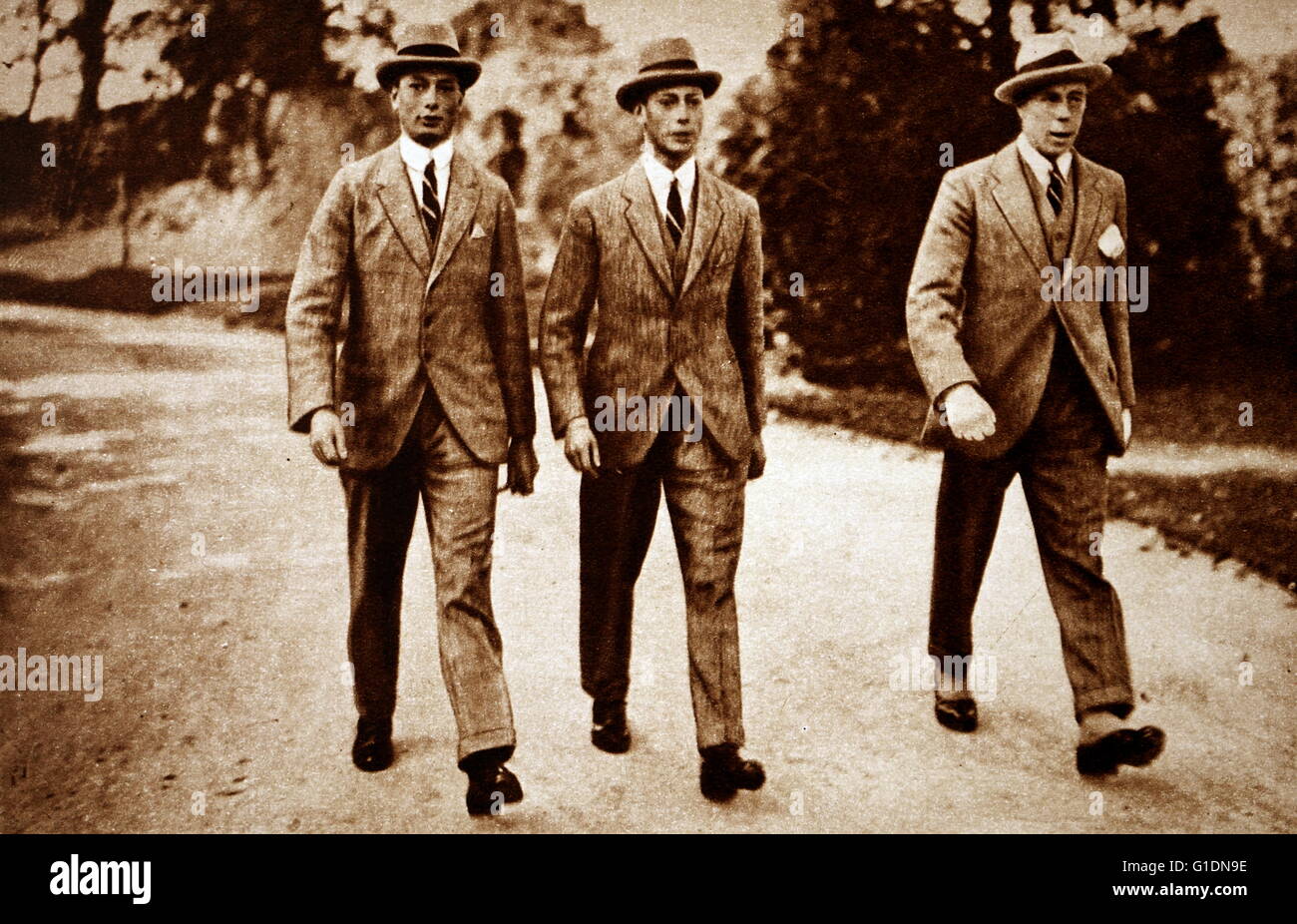 Photograph of Prince Albert Frederick Arthur George (1895-1952), Prince Henry, Duke of Gloucester (1900-1974) and Commander Louis Greig (1880-1953) walking together in Cambridge. Dated 20th Century Stock Photo