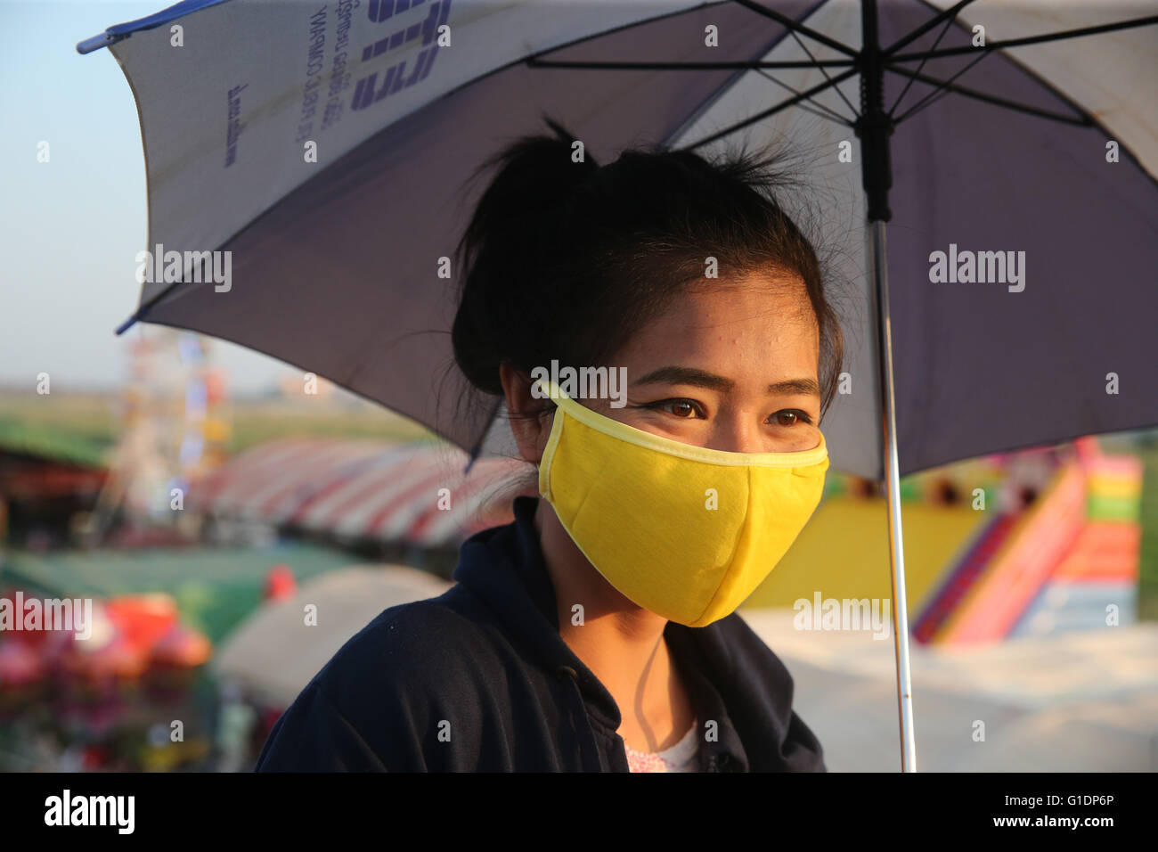 Portait. Woman with mask due to pollution. Vientiane. Laos Stock Photo