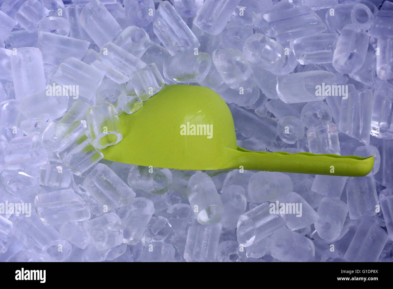 Close-up of icie-cubes and green plastic spoon.  Vientiane. Laos. Stock Photo