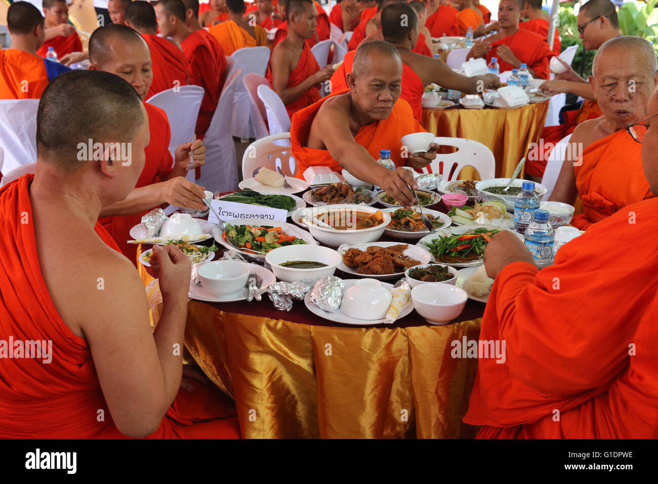 Wat Ong Teu buddhist temple. Buddhist monks having vegetarian lunch in