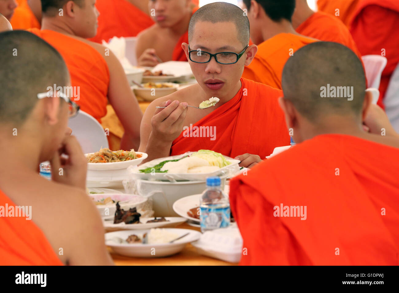 Monk eating in temple vientiane hires stock photography and images Alamy