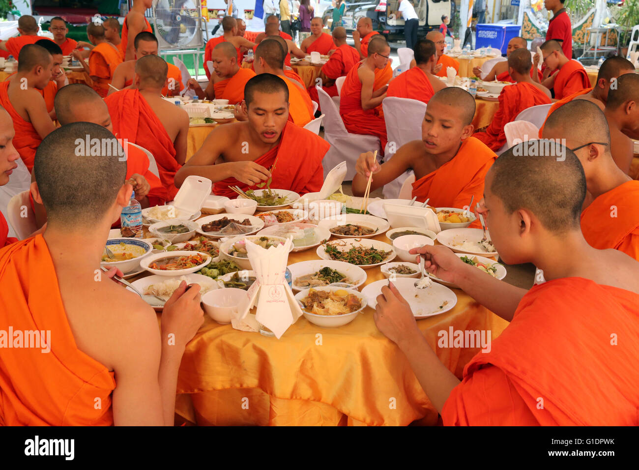 Wat Ong Teu buddhist temple. Buddhist monks having vegetarian lunch in