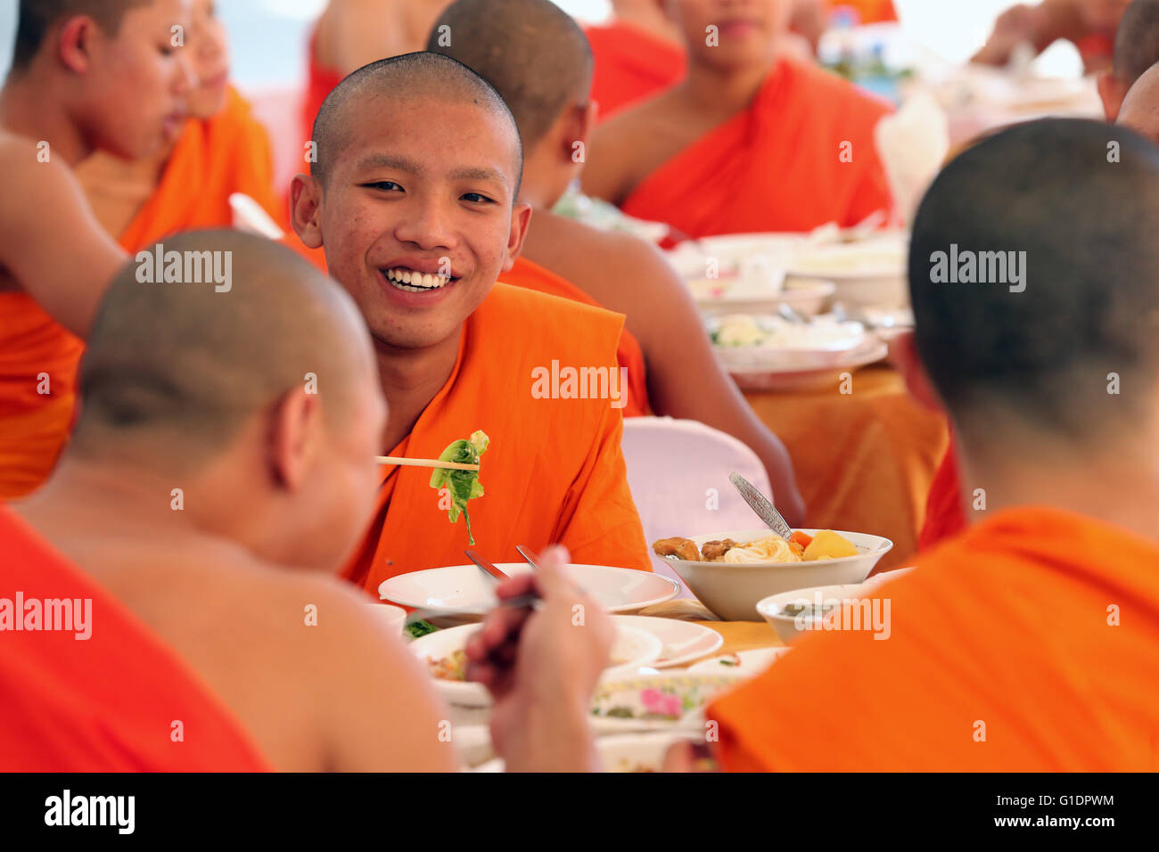 Wat Ong Teu buddhist temple. Buddhist monks having vegetarian lunch in