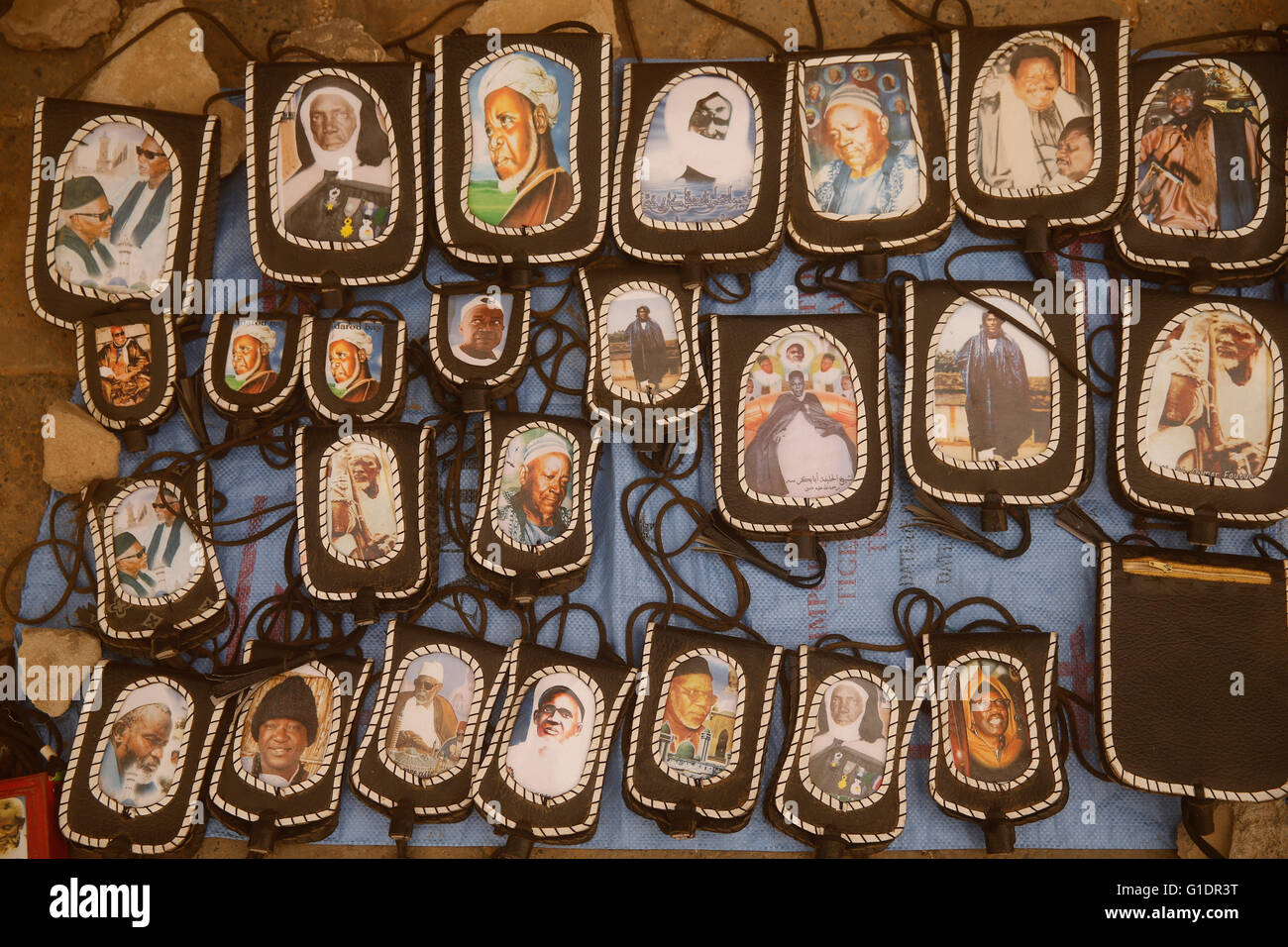Pendants with pictures of Muslim spiritual leaders. Senegal. Stock Photo
