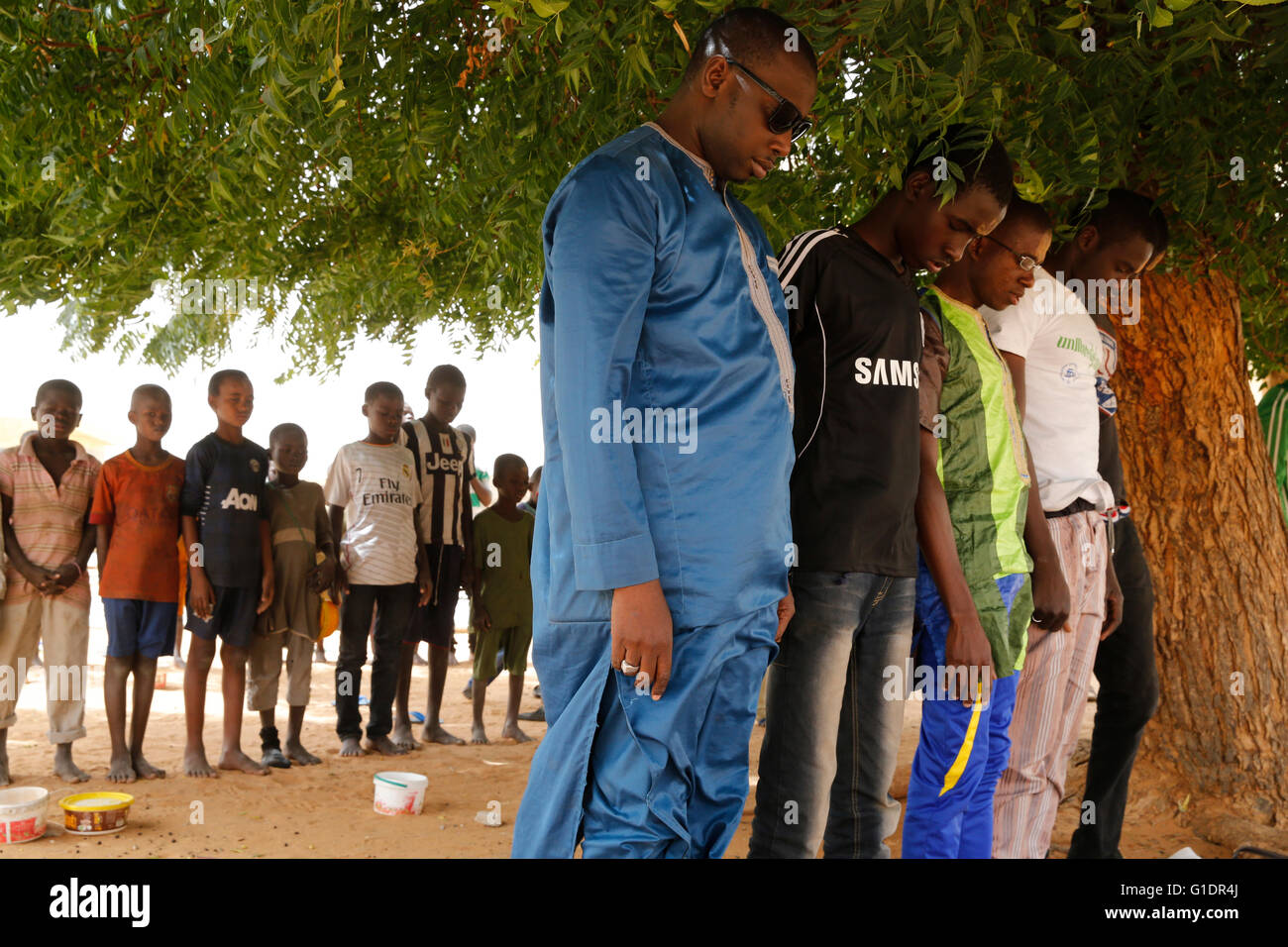 Friday afternoon prayer at Kebemer mosque, Senegal. Kebemer. Senegal. Talibe boys at the back. Stock Photo