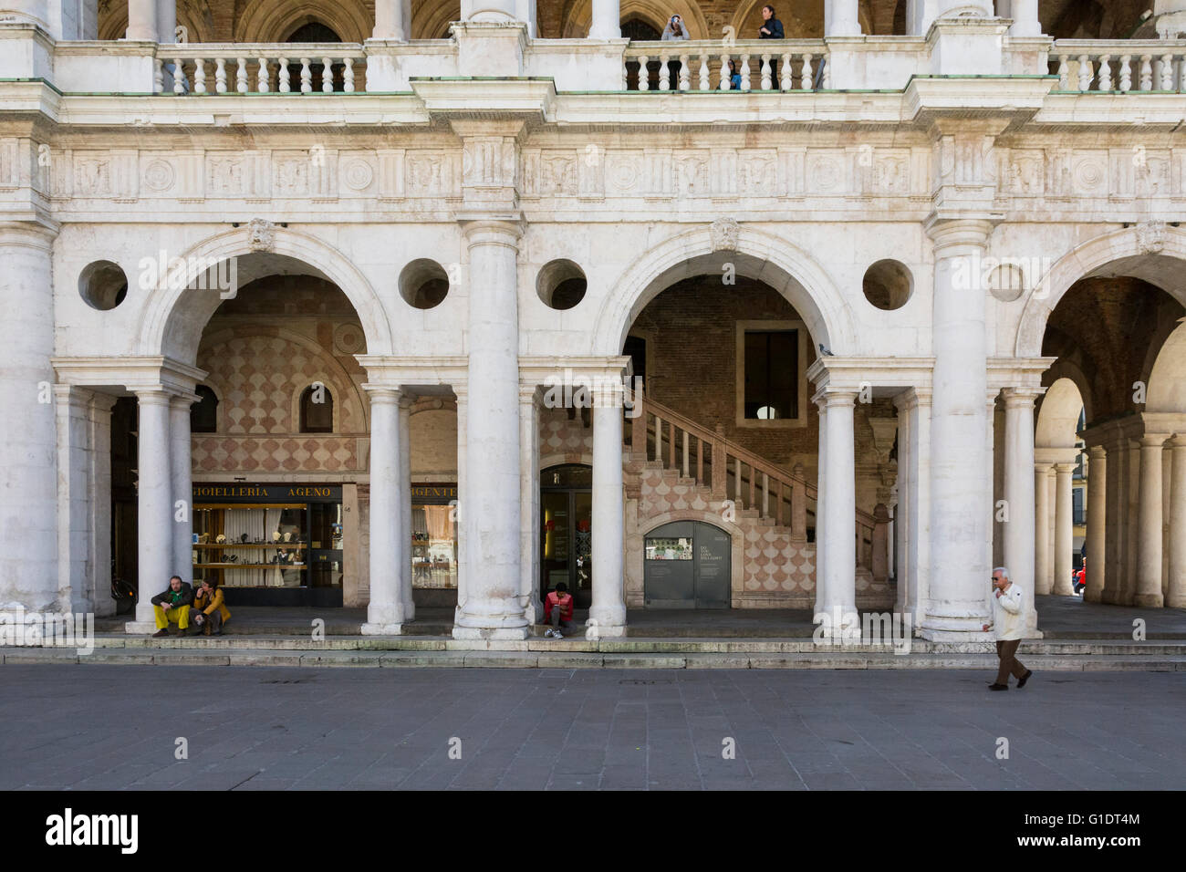 Vicenza,Italy-April 3,2015:people stroll near the Palladian basilica in the center of Vicenza during a sunny day. Stock Photo