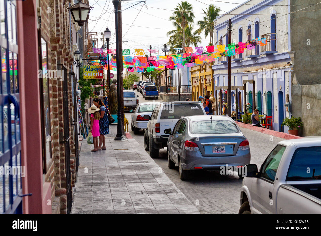 Street scene in Todos Santos, Baja, Mexico showing fiesta banners. Stock Photo