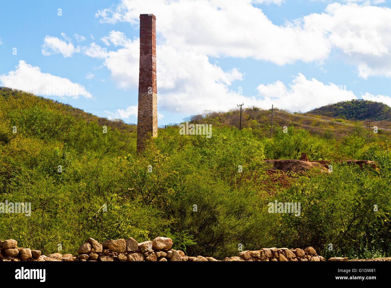 A square brick and stone smokestack at an abandoned silver mine in El Triunfo, Baja Sur, Mexico. Stock Photo