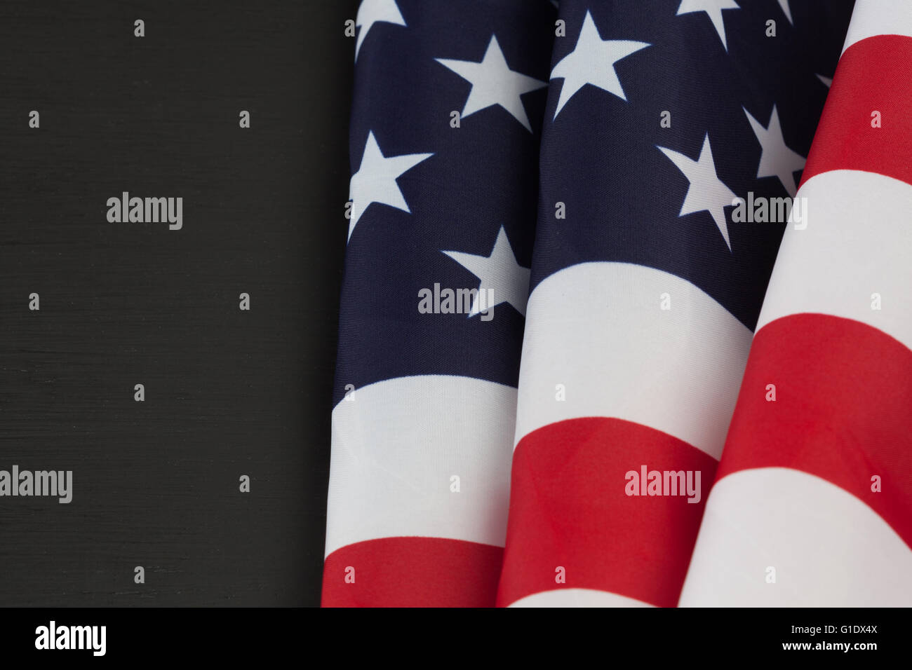 American flag folds on black chalkboard with copy space Stock Photo Alamy