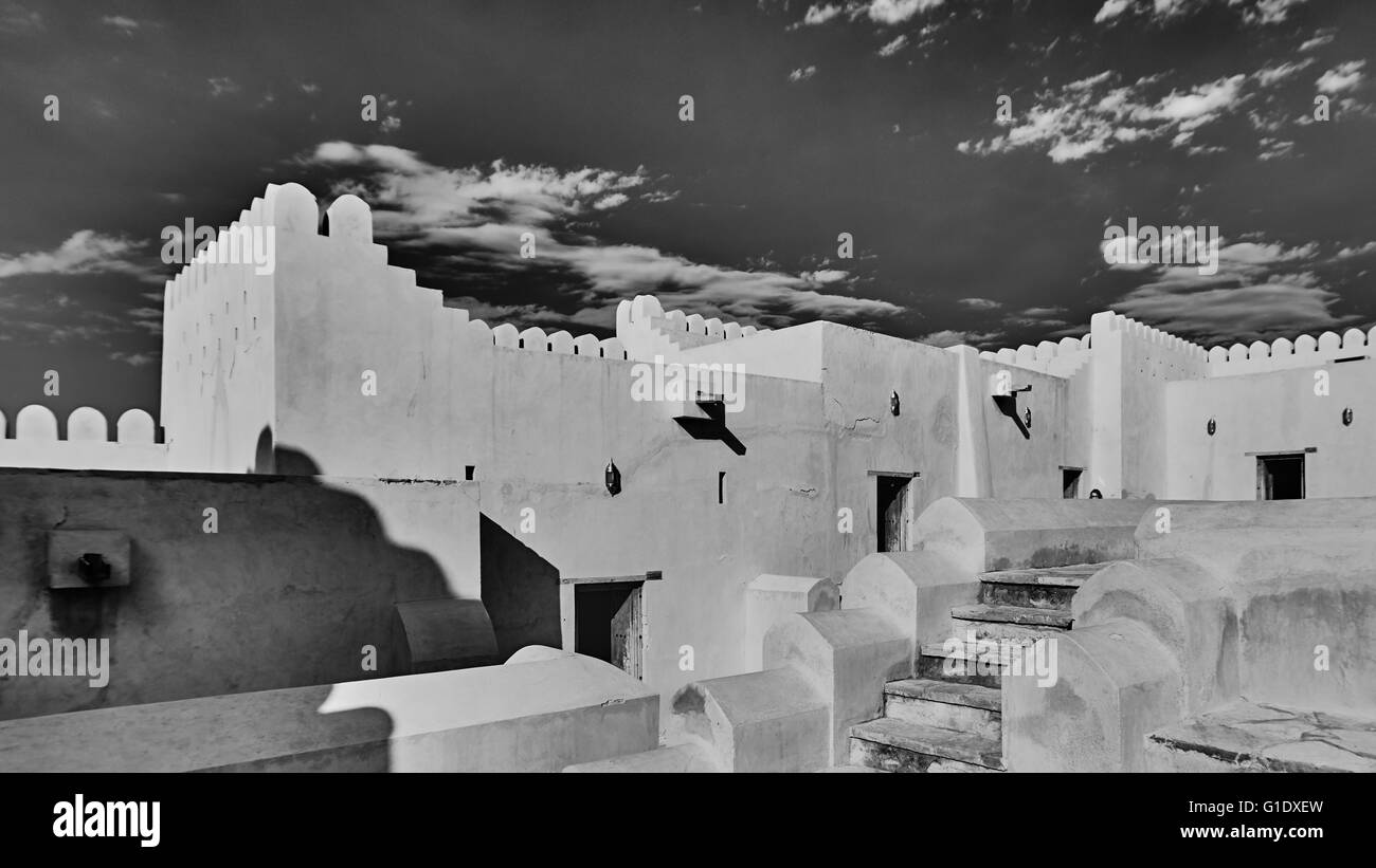 A historical fort with views of the inside of the fort walls and passages in black and white Stock Photo
