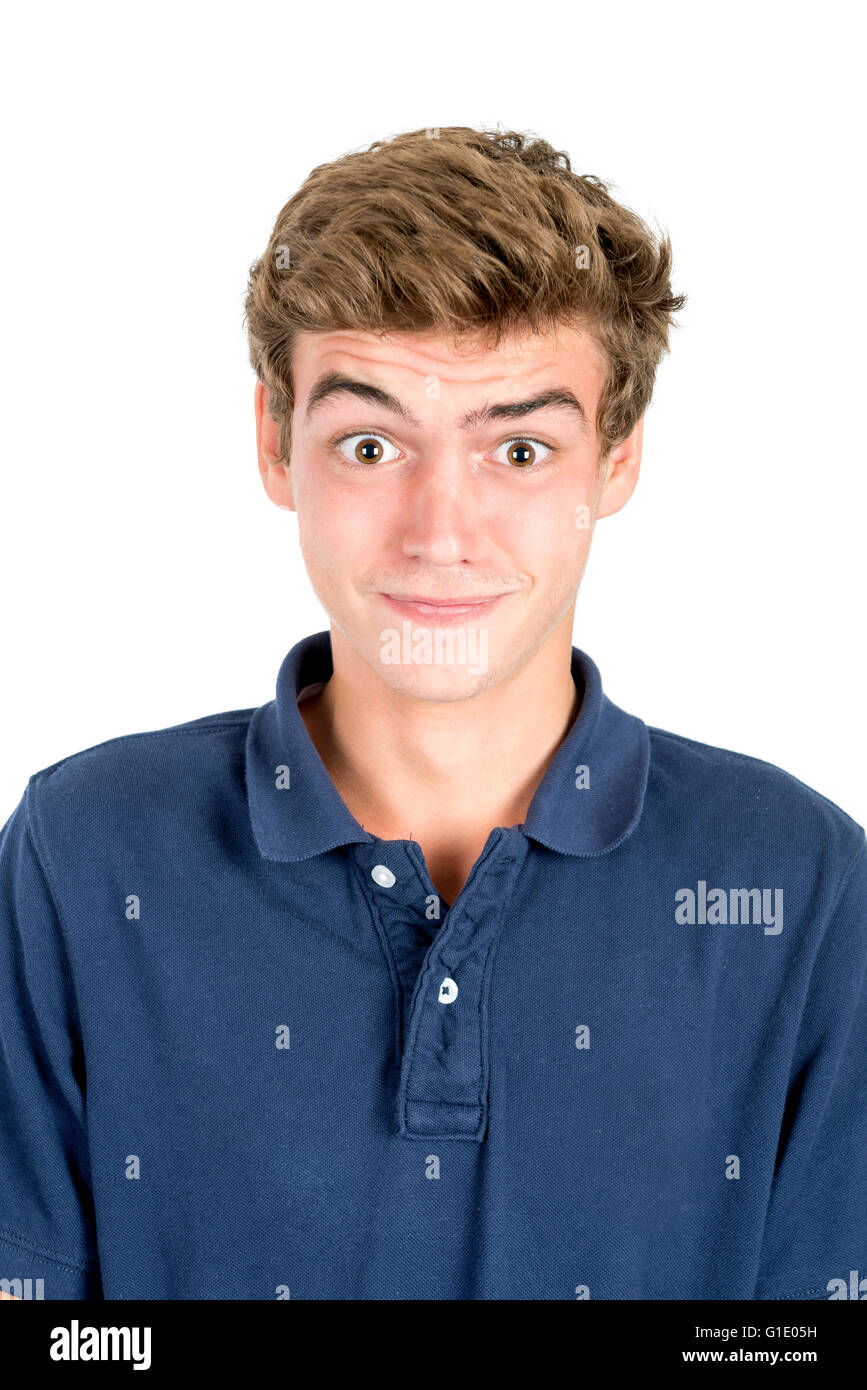 Surprised teenage boy making faces isolated in white Stock Photo