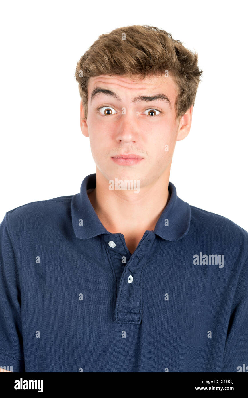 Surprised teenage boy making faces isolated in white Stock Photo