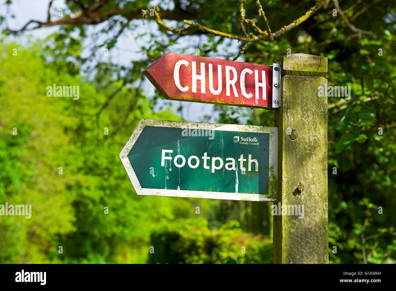 Signs for church and footpath, England UK Stock Photo