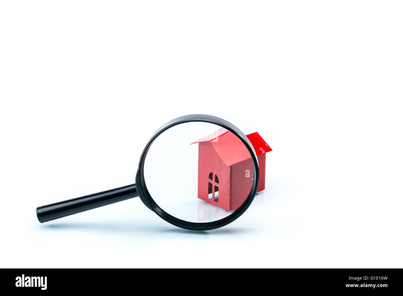 house scrutiny concept, house model with magnifying on white background Stock Photo