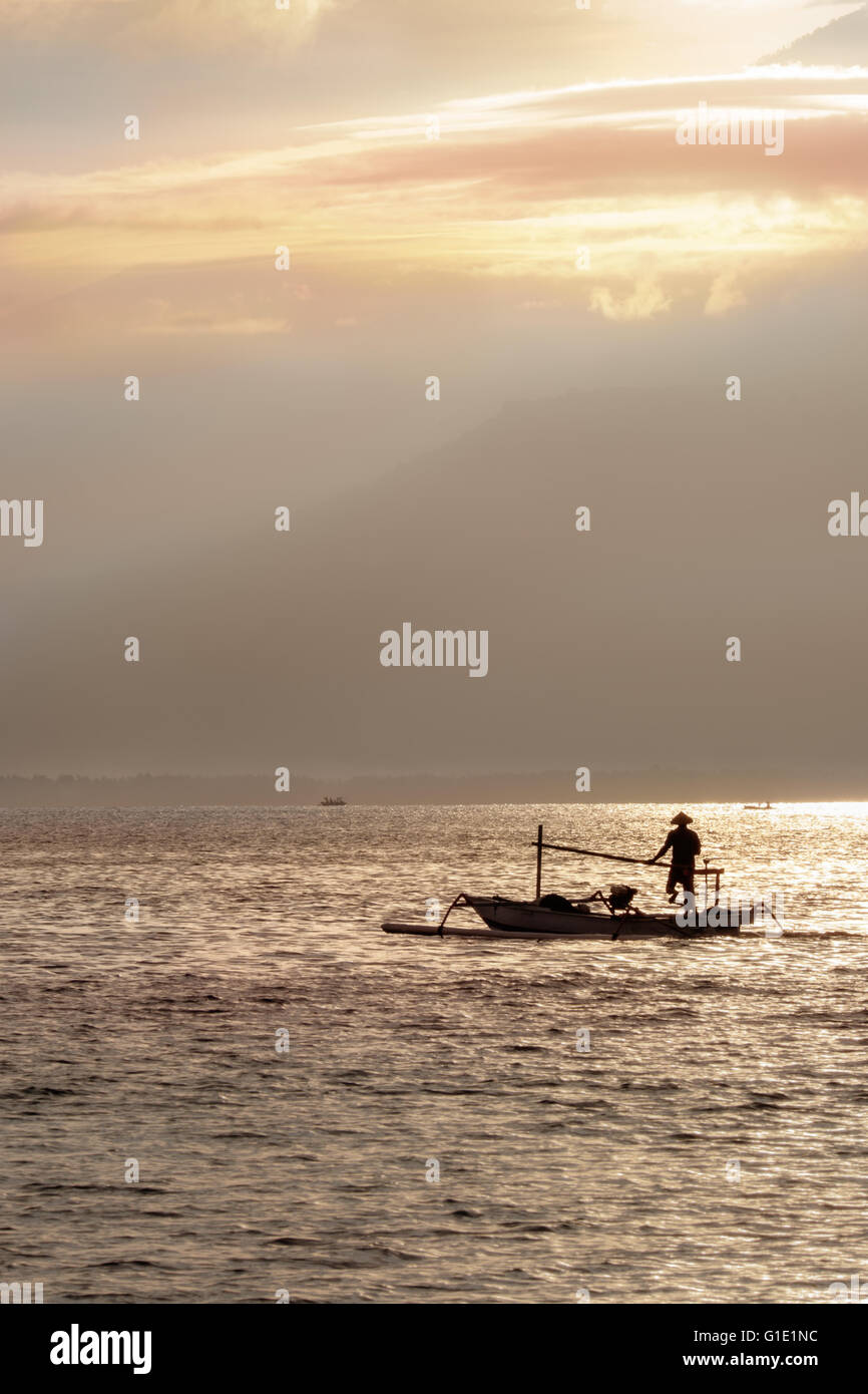 The fisherman boat in the sea in the morning near Rinjani volcano, lombok, indonesia Stock Photo