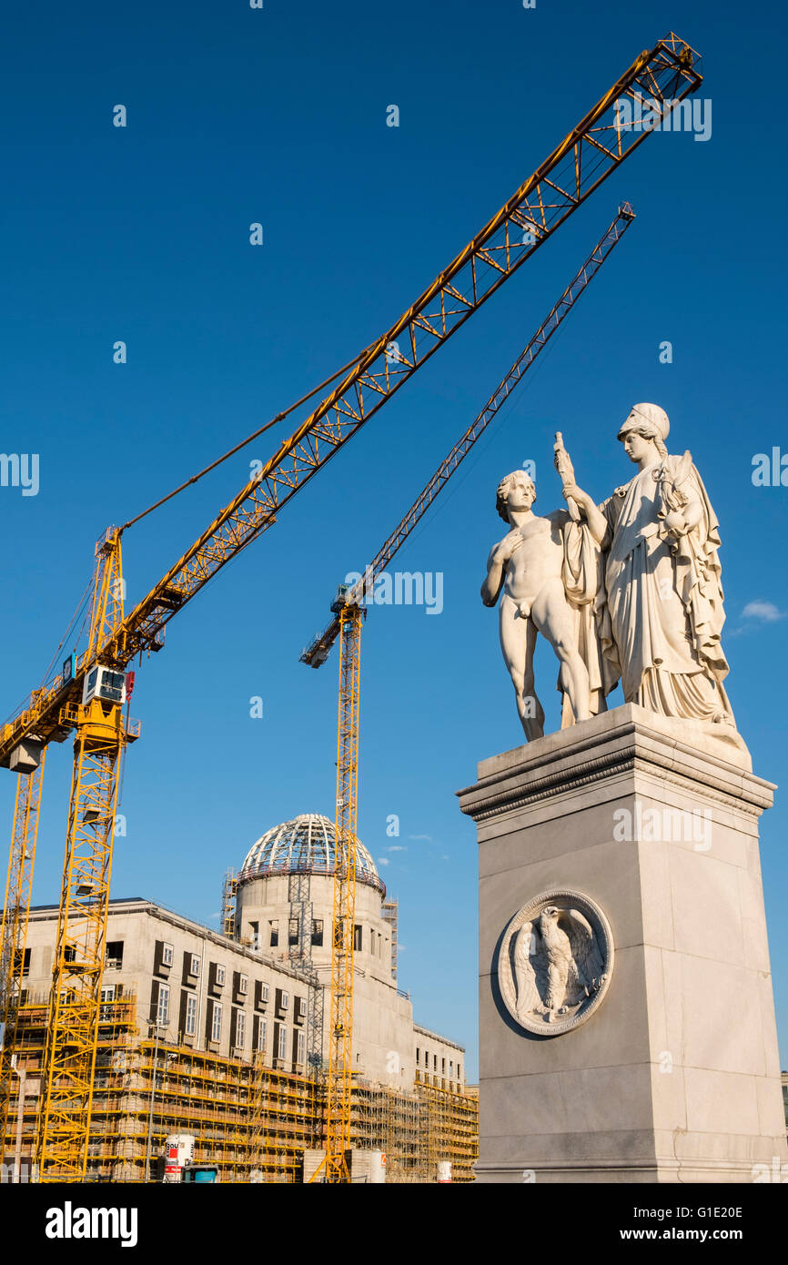 Historic statue on Palace Bridge beside construction site of new Berlin Palace, (Schloss)  in Mitte Berlin Germany Stock Photo