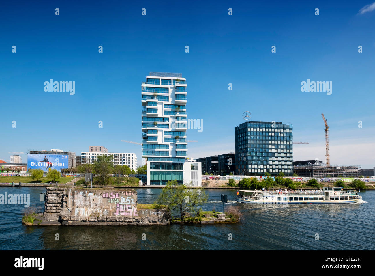 New luxury high-rise apartment building built beside Berlin Wall on River Spree in Friedrichshain Berlin Germany Stock Photo